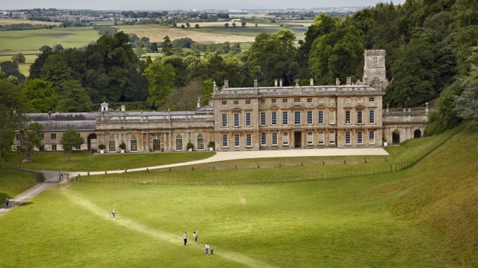 View of the east side of Dyrham Park house with parkland and views behind and people in foreground. Dyrham Park, South Gloucestershire